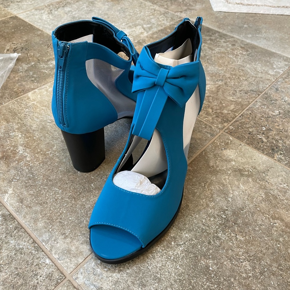 Blue never worn before high heels adorned with a bow